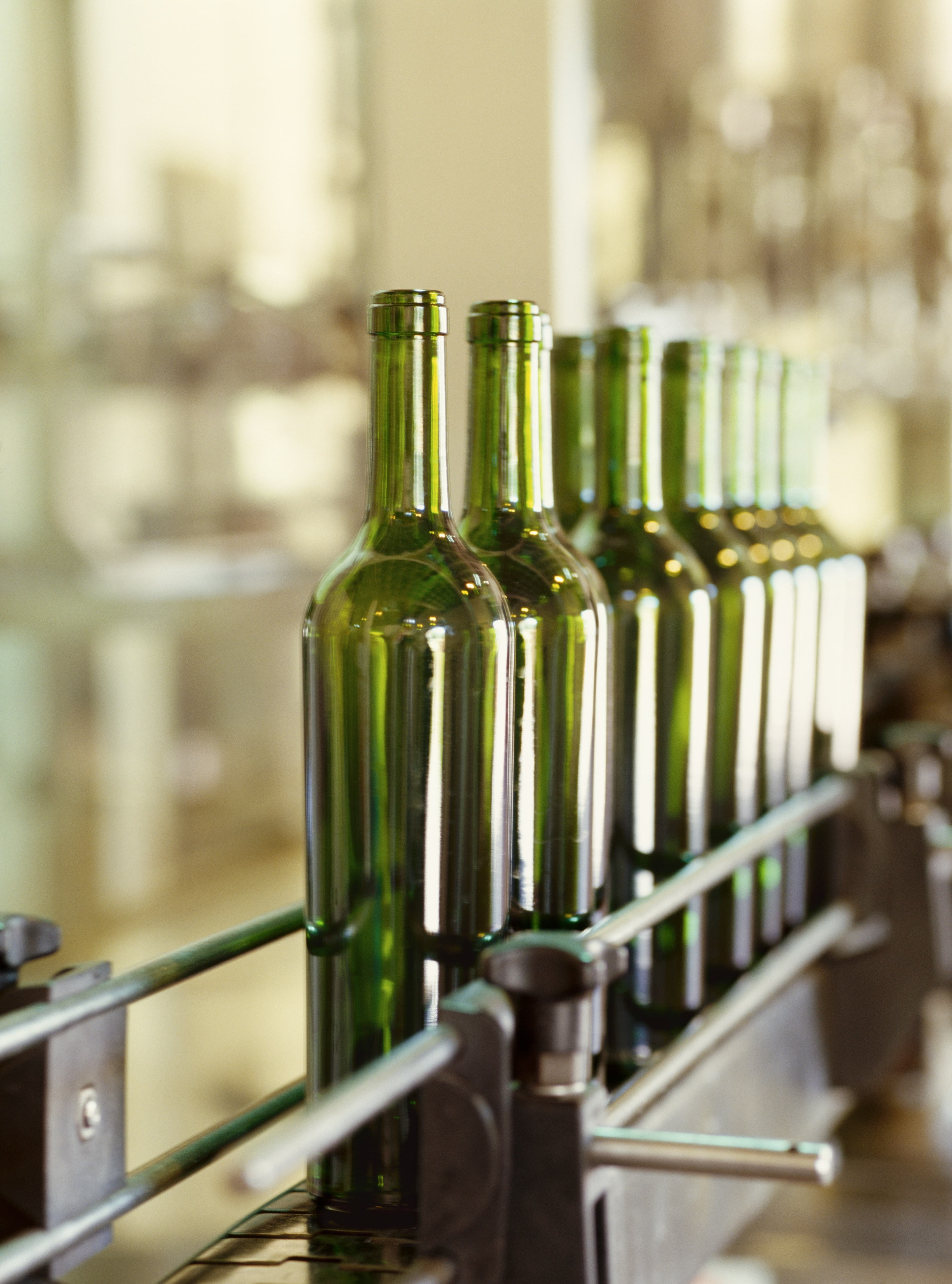 Glass bottles moving along an organic bottling line